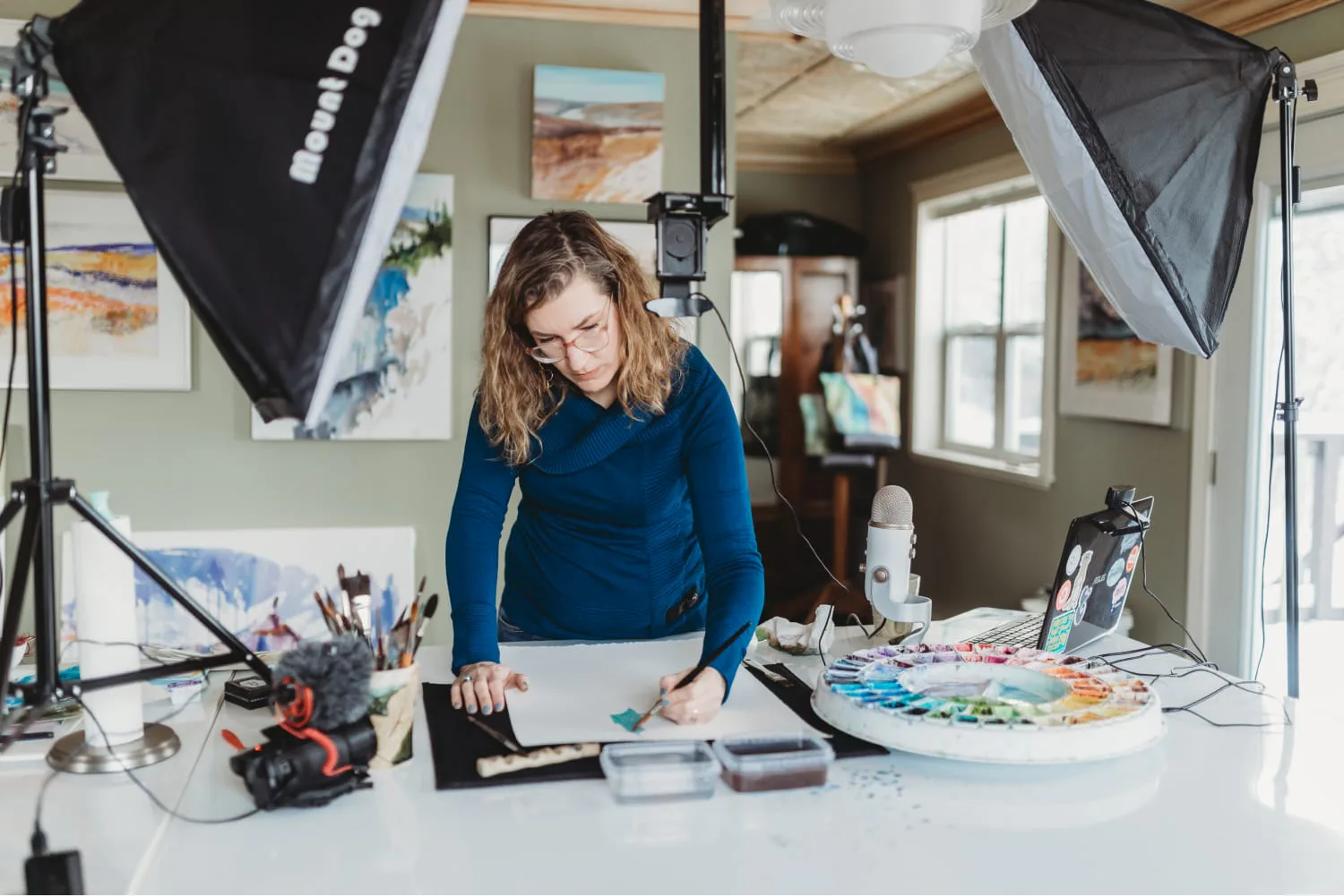 Angela Fehr painting in studio