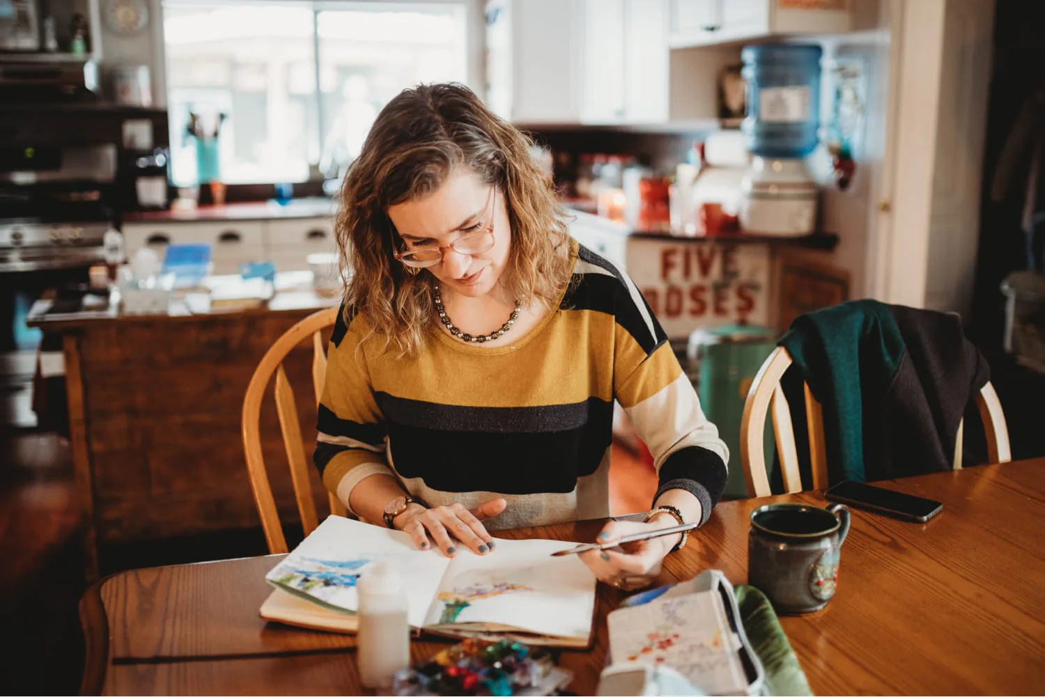 Angela Fehr painting at table