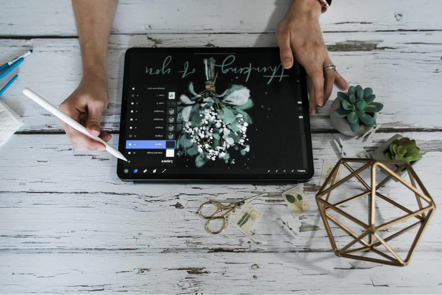 creator drawing on tablet