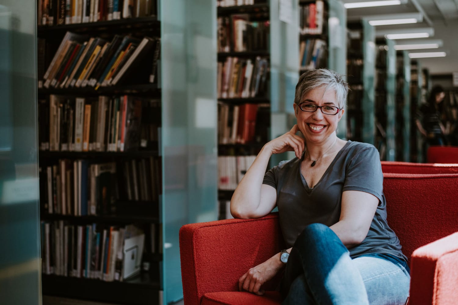 Creator full portrait in library Jessica Abel