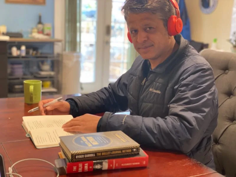 iaac-srini-rao-writing-with-headphones