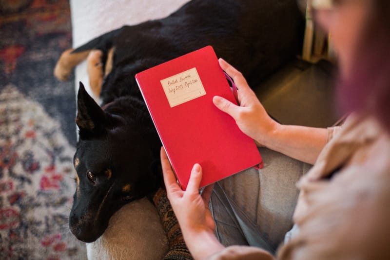 iaac-shelby-abrahamsen-with-dog-and-red-journal