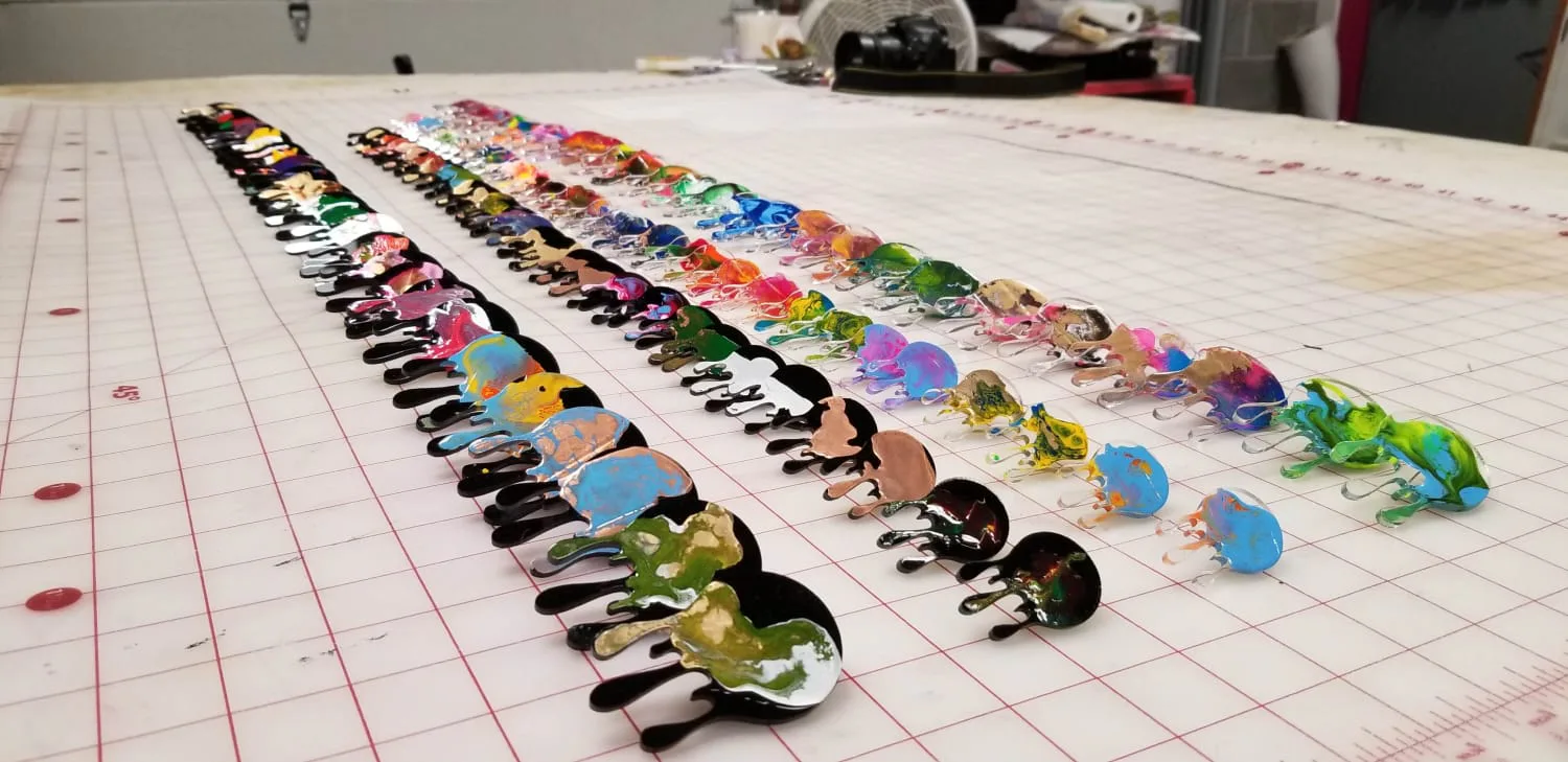 iaac-whitney-manney-multiple-earings-on-display-closeup