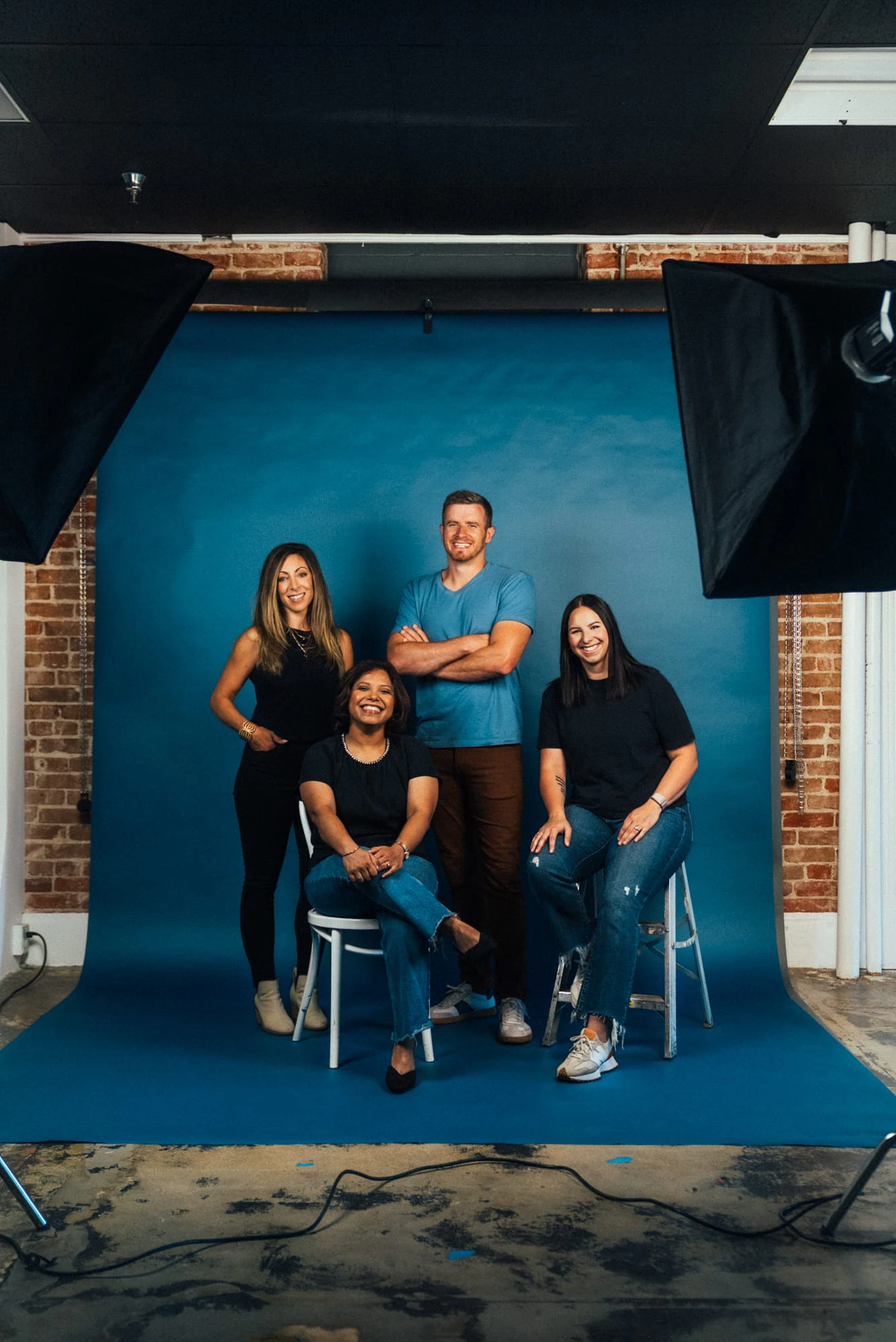 A group of creators sitting and standing together