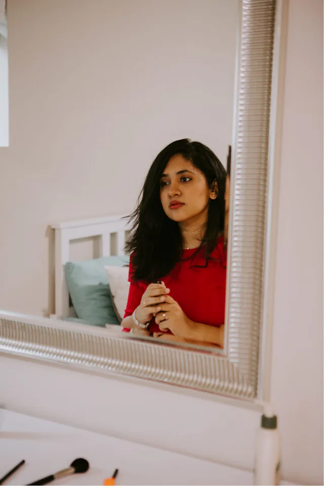 Creator looking in mirror