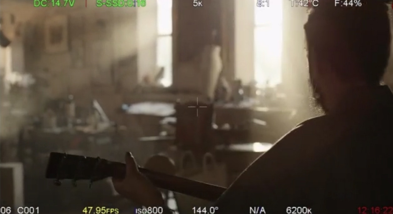 A look through the camera at a shot of Calvin on set