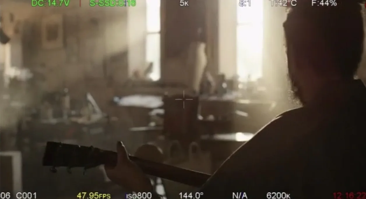 A look through the camera at a shot of Calvin on set
